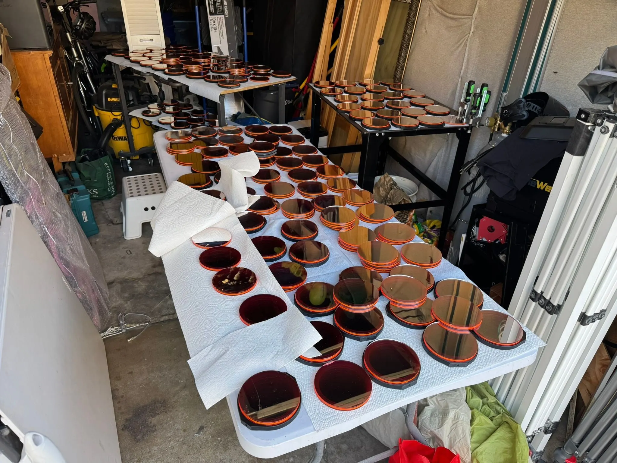 A garage workbench covered in finished mirror modules