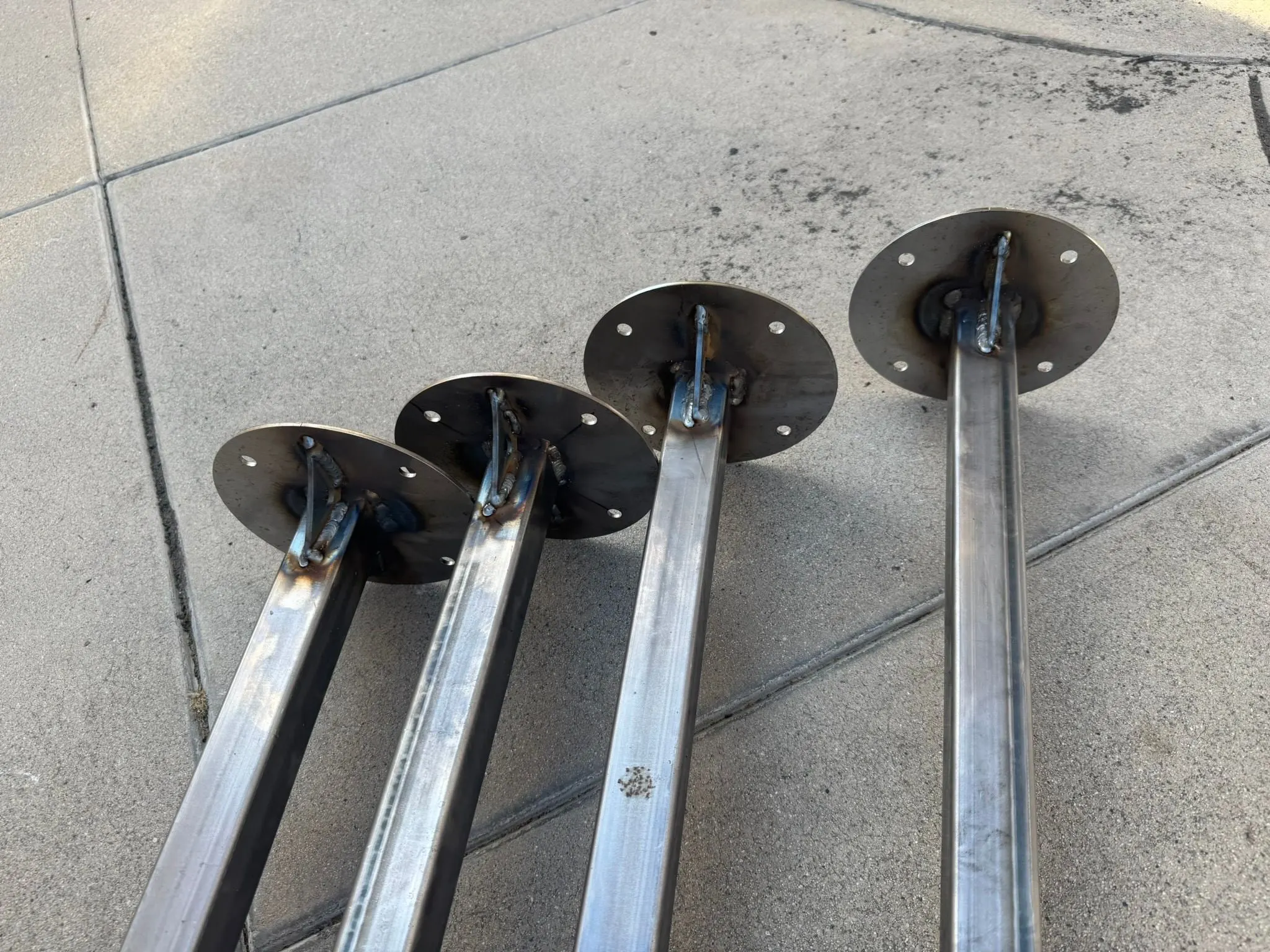 Four legs with round foot plates welded on