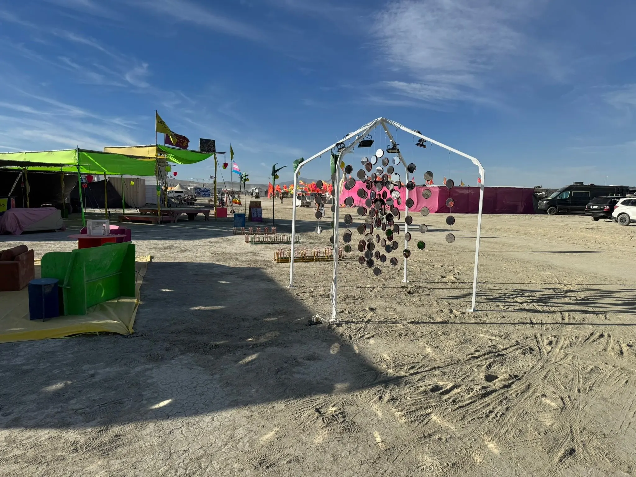 The installation in bright daylight on the playa, long shadows on the dust